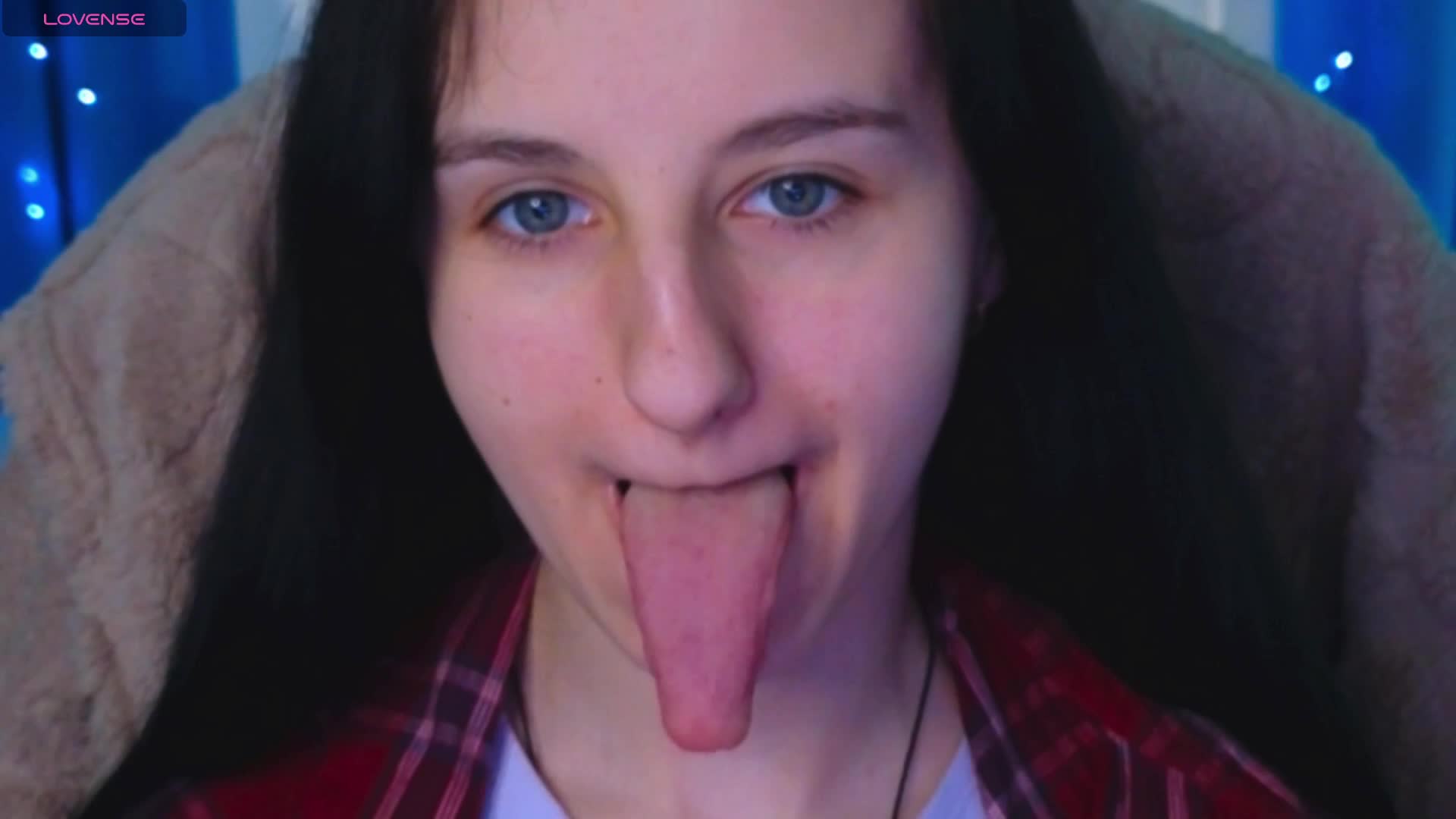 demonstration of a long tongue and bare chest at close magnification