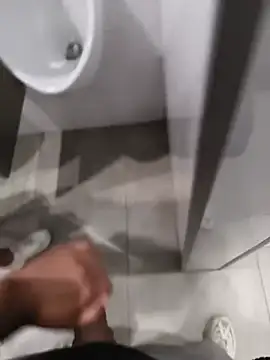 Secretly sucking a chicken in a public bathroom