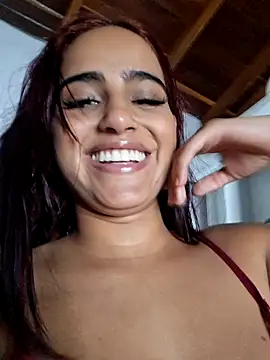 With my fingers up my ass while I finger my pussy.