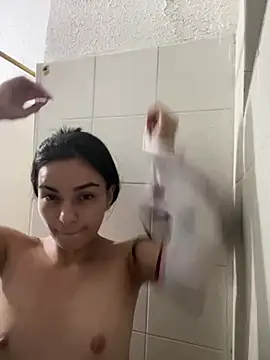 GIRL FINGERS HERSELF IN THE ASS WHILE TAKING A SHOWER