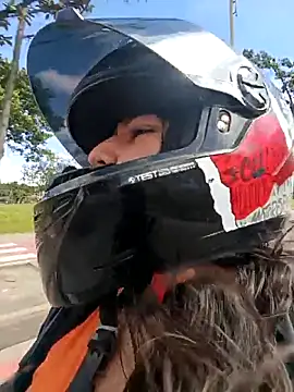 On the motorcycle at full speed, I get turned on by touching my breasts.