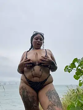 in rain in beach, open and shake titis