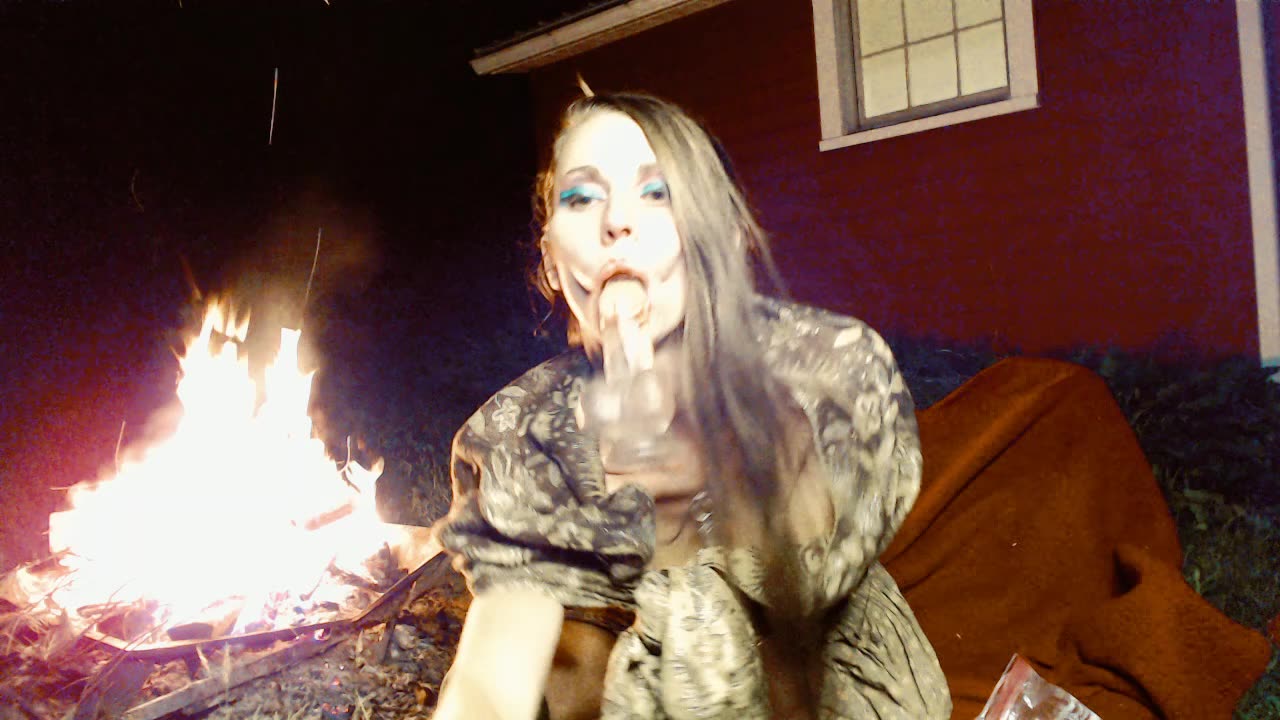 Sucking and fucking my dildo outside by the bonfire