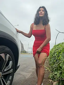 Squirting on a very public street and tits out.