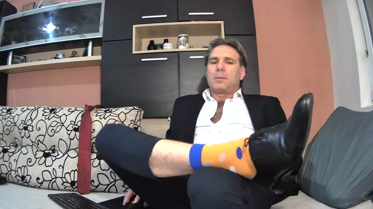 Suit ,shoes,orange socks ,feet and haaard ciock !!!!!