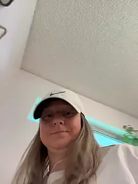 Sexy with hat on playing with vibrator standing over you
