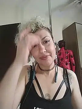 Dressed in fishnet stockings, masturbating very calmly and still showing off my plugged ass.